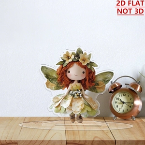 Flat 2D acrylic flower girl ornament with wings on a wooden desk with a vintage clock