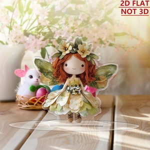 Detailed view of 2D flat acrylic fairy ornament on a light wooden table surface