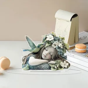 Detailed view of 2D flat acrylic floral girl ornament on a desk with warm home decor