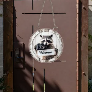 Close-up of a 2D flat raccoon welcome sign on clear acrylic with a metal hanging chain