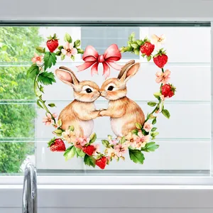 Detail of Easter window cling featuring kissing bunnies in a floral strawberry wreath
