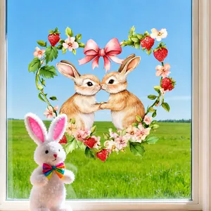 Close-up of Easter rabbit window cling with floral heart wreath on glass pane