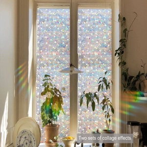 Detail of floral window film showing white flowers and rainbow refraction effect