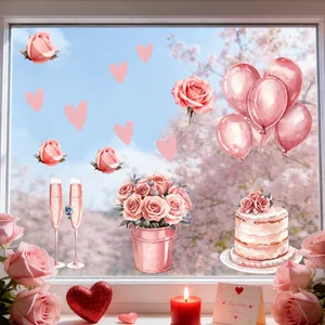 Detalle de pegatinas de San Valentín con rosas, globos y tarta sobre cristal de ventana