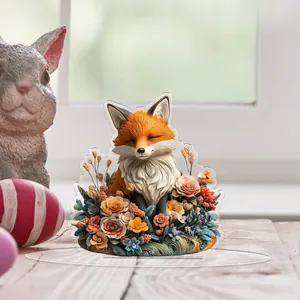Detailed 2D acrylic fox ornament featuring colorful floral patterns on a wooden desk