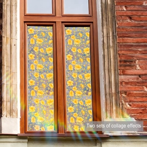 Detail view of yellow floral static window film stickers on a wooden frame