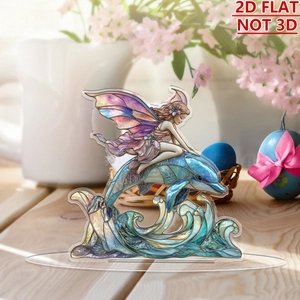 Detailed 2D flat acrylic ornament with fairy and dolphin design on a wooden desk