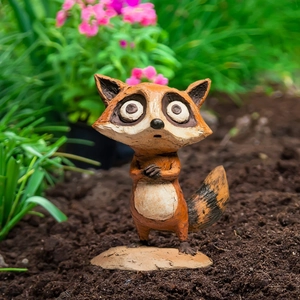 Detailed view of a cute cartoon raccoon garden stake ornament for outdoor flower pot decor