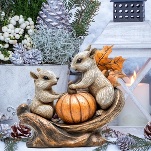 Squirrels and pumpkin resin statue home decor piece on natural wood base for autumn