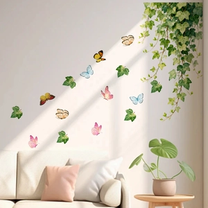 Watercolor butterfly wall stickers with green ivy leaves on a cozy living room wall