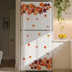 Close-up of autumn maple leaves and red berries self-adhesive stickers on a white fridge