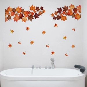 Detail of autumn maple leaf and berry wall stickers on a white bathroom wall decor