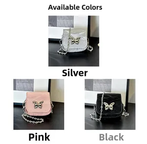 Detailed view of mini saddle bags in silver, pink, and black with butterfly metal buckles
