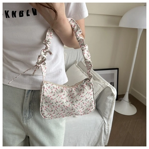 Floral hobo bag with ruched shoulder strap and cute bow detail for summer outfit