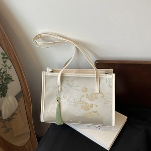 New Chinese style cream tote bag with floral embroidery and green silk tassel decoration