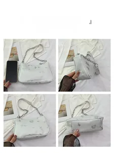 Four-angle view of white Chinese style shoulder bag with floral embroidery and chain strap