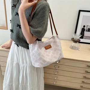 Chic geometric knit tote bag with long brown straps for women's stylish commuting