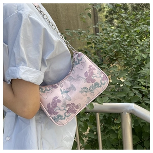 Detail of lavender jacquard shoulder bag with Chinese landscape embroidery and chain strap