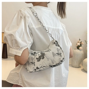Detail of New Chinese style bag with bird prints and silver metal chain strap