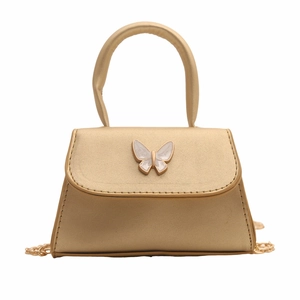 Champagne gold mini crossbody bag with a white bow buckle and gold chain strap