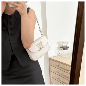 Detail of off-white leather shoulder bag with silver logo and knot strap detail