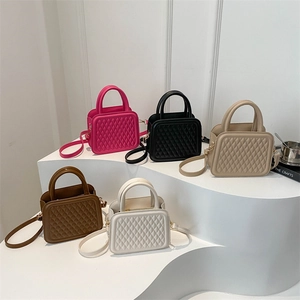 Quilted crossbody bag set featuring five colors with top handles and adjustable straps