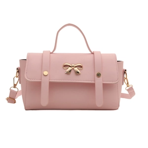 Pink retro crossbody bag with golden bow hardware and adjustable shoulder strap