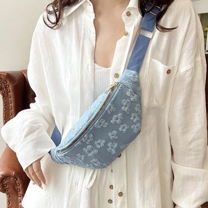 Light blue floral embossed crossbody chest bag for women with woven strap for casual styling