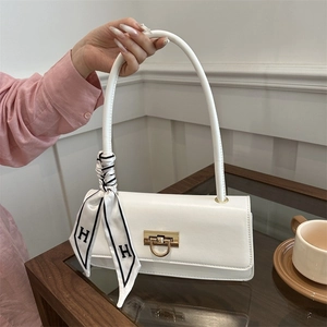 Chic white baguette underarm bag with decorative silk scarf and gold U-shaped buckle