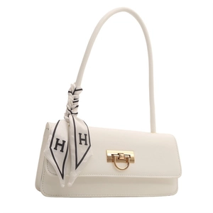 Detail of white PU leather bag with gold U-shaped buckle and silk scarf with H pattern