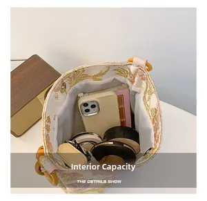 Top view of jacquard floral bucket bag showing spacious interior with personal essentials