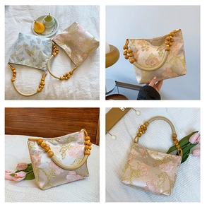 Detailed close-up of retro floral jacquard handbag with elegant wooden bead handles