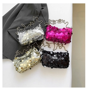 Detail showing mini chain bag with high-density sequins in silver, pink, gold and black
