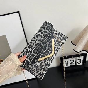 Leopard print envelope clutch with gold metal V-trim and detachable chain strap