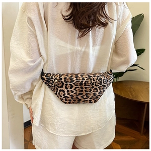 Detail view of leopard print PU leather waist bag worn on back with gold hardware