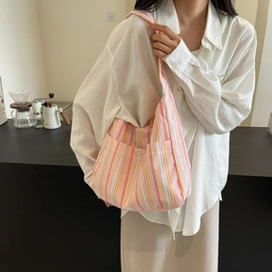 Large colorful striped canvas tote bag for women showing spacious daily commute design