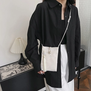 Chic cream textured small crossbody phone bag with pearl button and white tassel detail