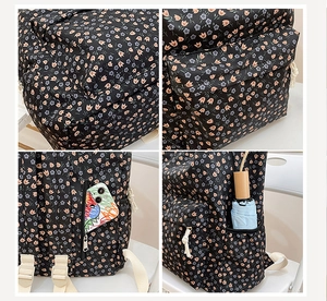 Detail of floral backpack with side umbrella pocket and adjustable beige woven straps
