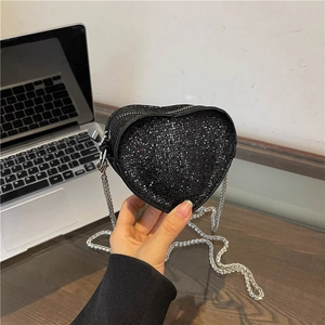 Sparkling heart-shaped mini crossbody bag with black sequins and silver chain strap
