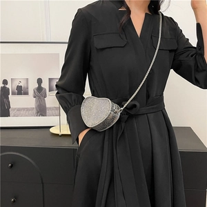 Mini heart-shaped silver rhinestone crossbody bag with metallic chain strap for women