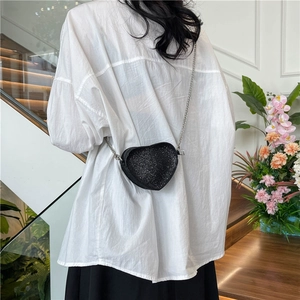 Elegant heart-shaped black crossbody bag with sparkling rhinestones and silver chain strap
