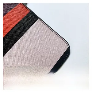 Detail of color-block checkered leather with fine lychee texture and neat stitching