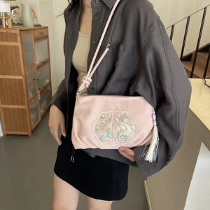 Pink satin crossbody bag with traditional Chinese embroidery and white silk tassel