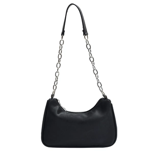 Classic black leather crescent underarm bag with silver chain strap on white background