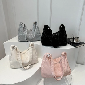 Metallic crinkled large tote bag in black silver cream and pink on display