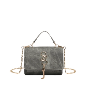 Grey suede shoulder bag with golden S-buckle and chain strap shown on white background