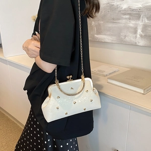Elegant pearl white shell bag with gold heart studs and vintage kiss lock closure