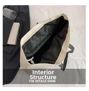 Macro view showing the spacious black interior lining and zippered pocket of the tote bag