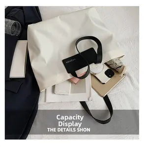 Detailed interior storage view of the white nylon tote bag showing its large capacity