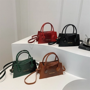 Minimalist crocodile pattern handbags in red, black, green, and brown with gold lettering